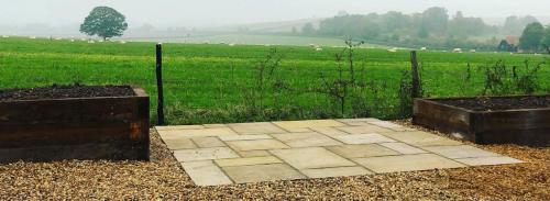 Indian Sandstone Paving with Raised beds